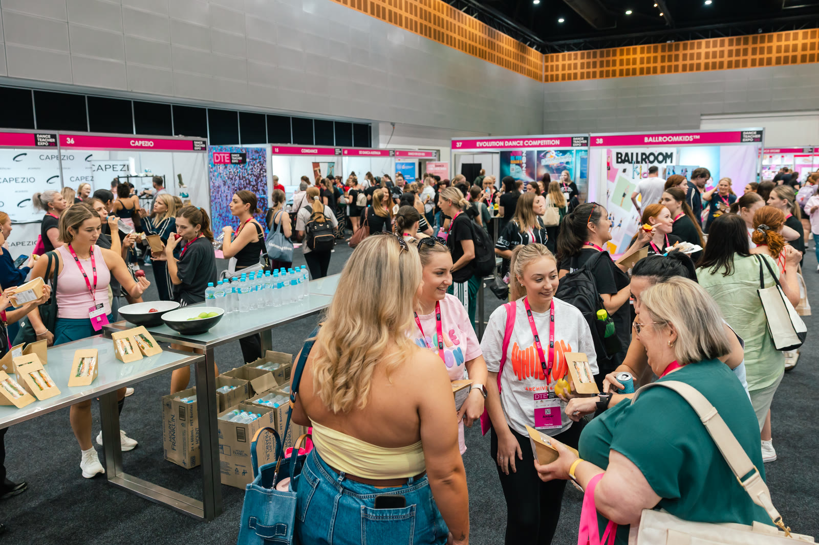 Teachers connecting across the busy vendor arena